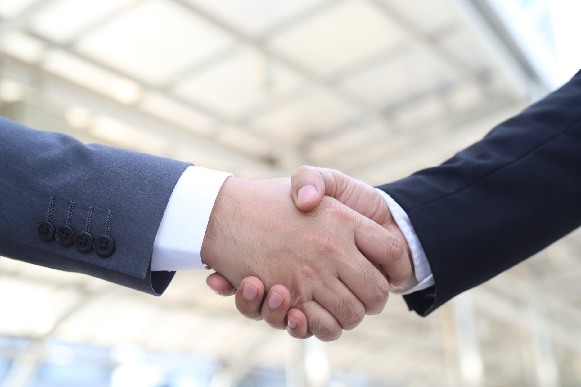 Business people shake hands and greet each other